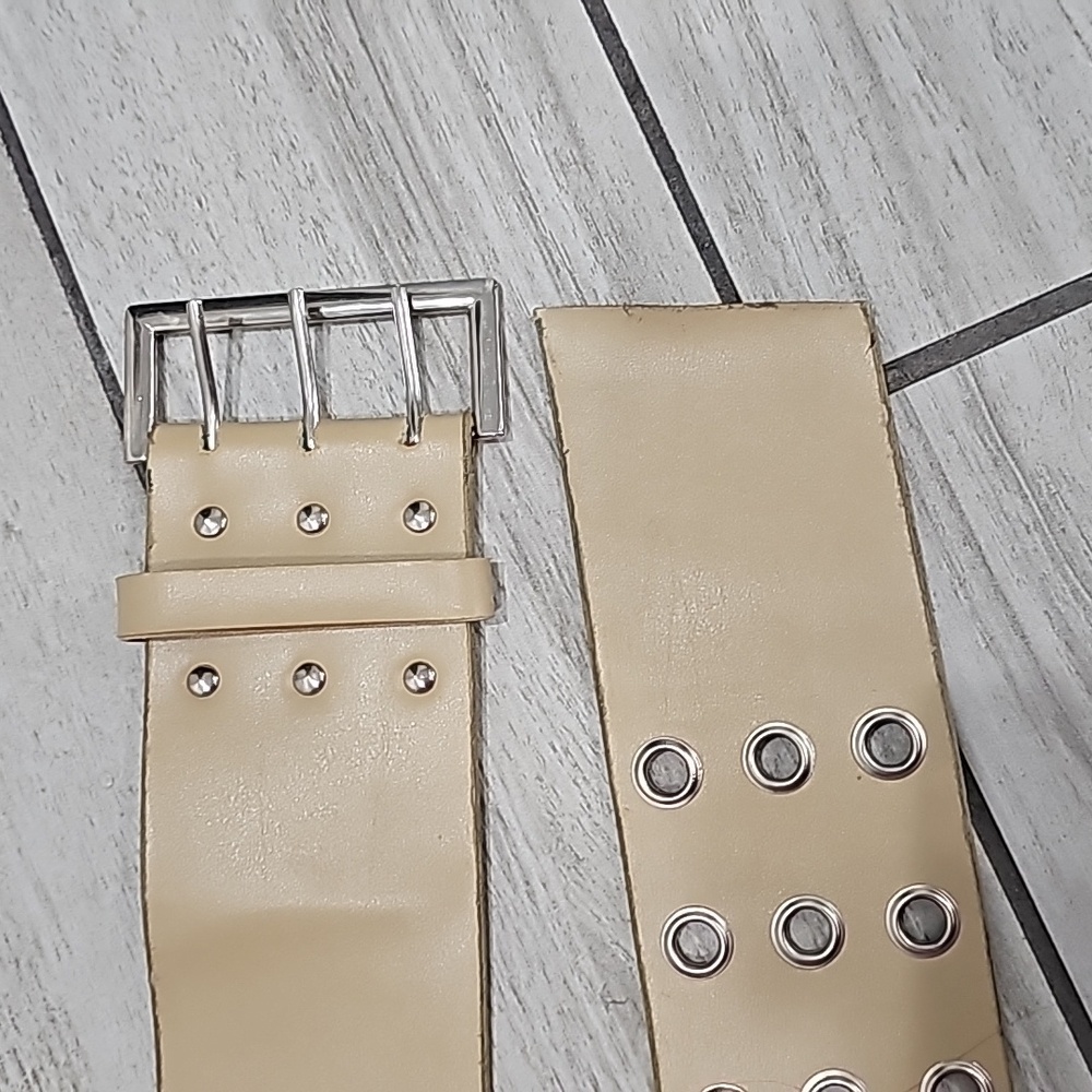 Thick studded belt.